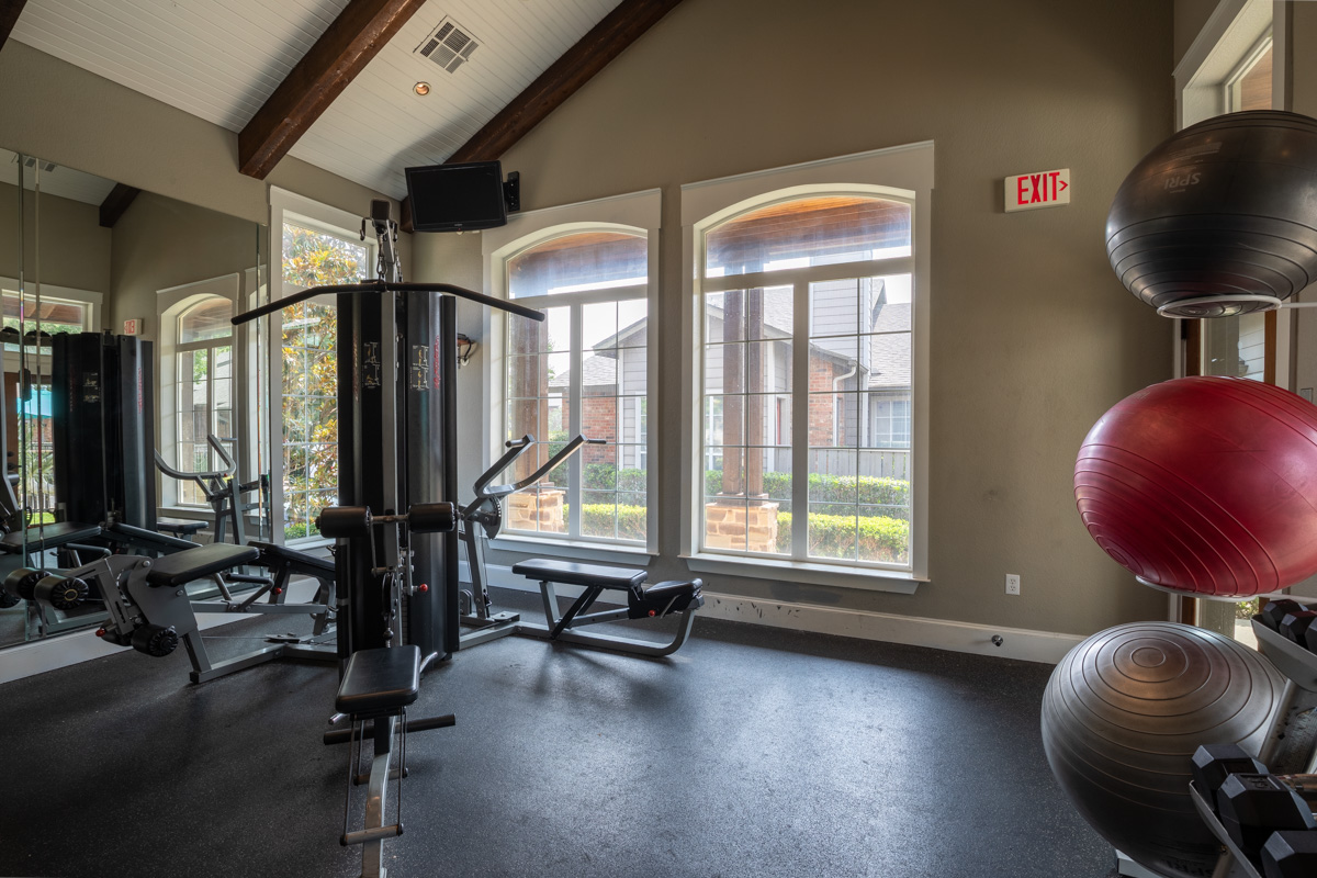 Brand new fitness center with cardio machines at our apartments at Bear Creek