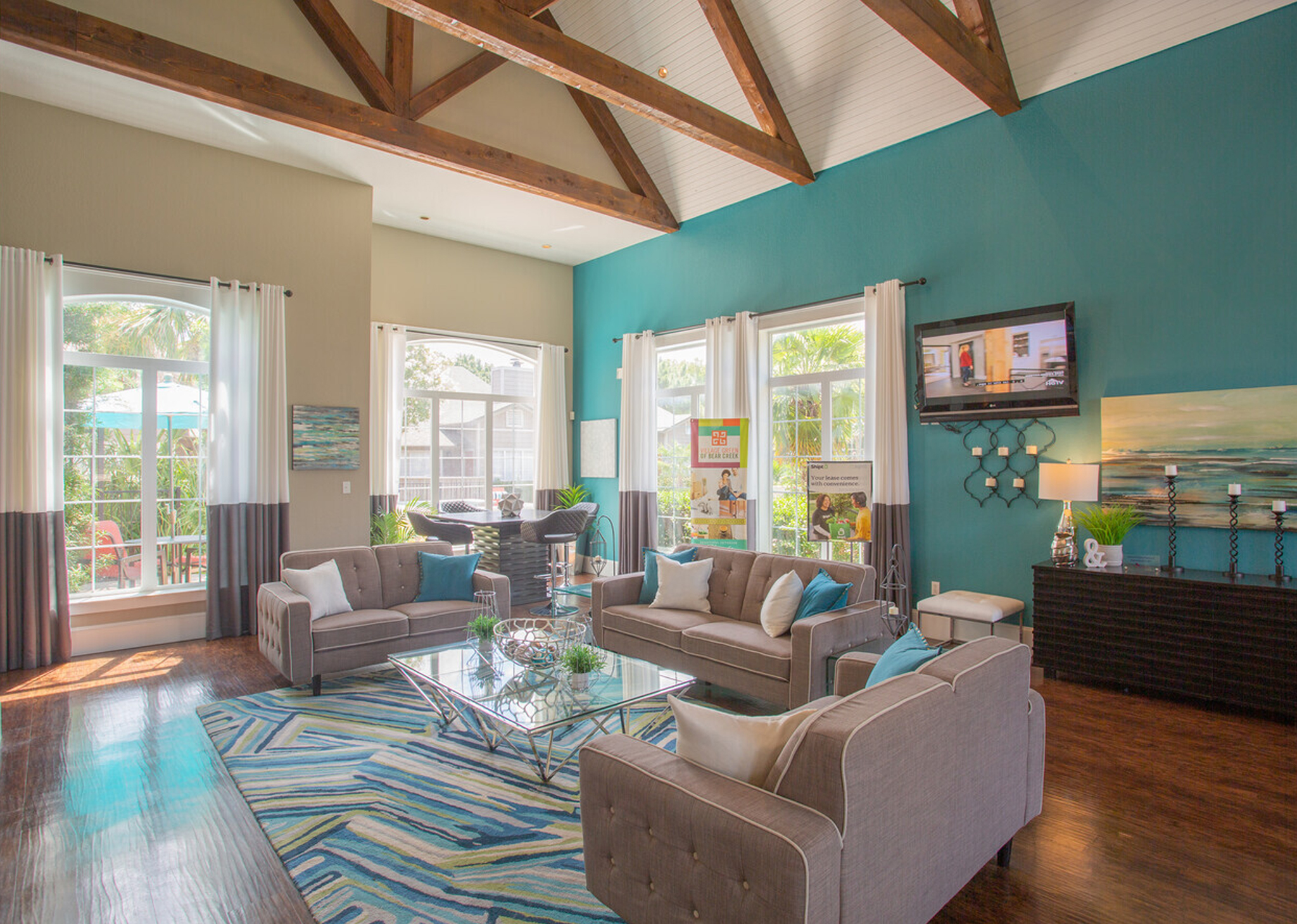 Outdoor lounge with comfy seating next to our resort-style swimming pool at our Euless apartments