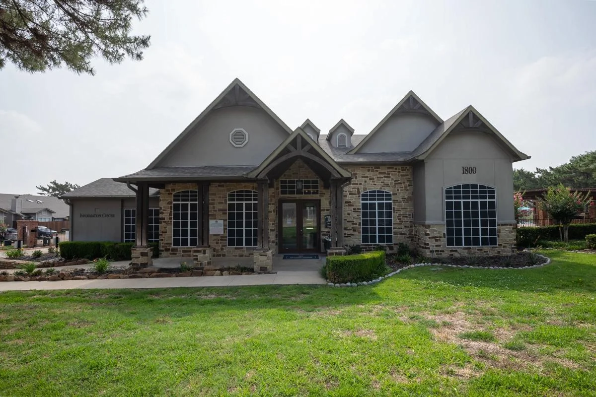 Resident clubhouse and architectural facade at Village Green of Bear Creek in Euless, Texas