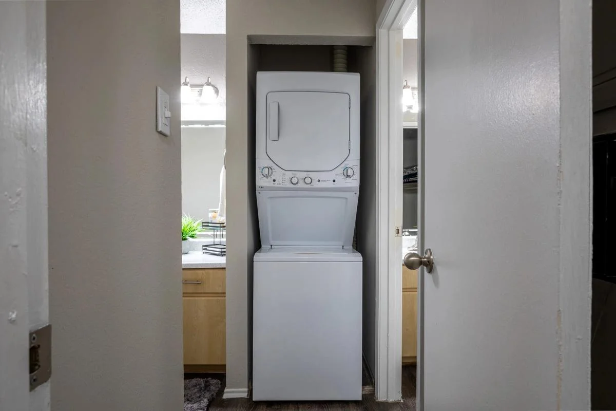 In-unit stackable washer and dryer at Village Green of Bear Creek in Euless, Texas
