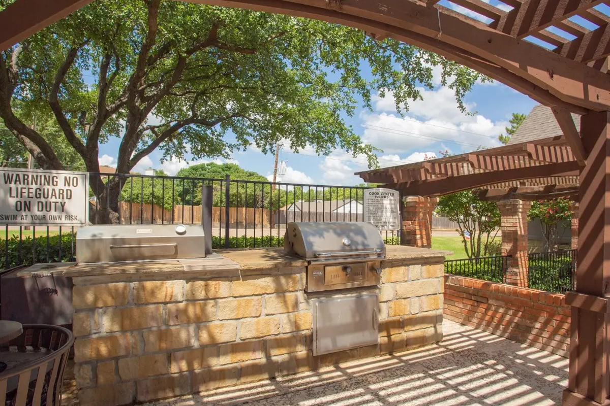 Outdoor kitchen and BBQ grilling pavilion at Village Green of Bear Creek in Euless, Texas