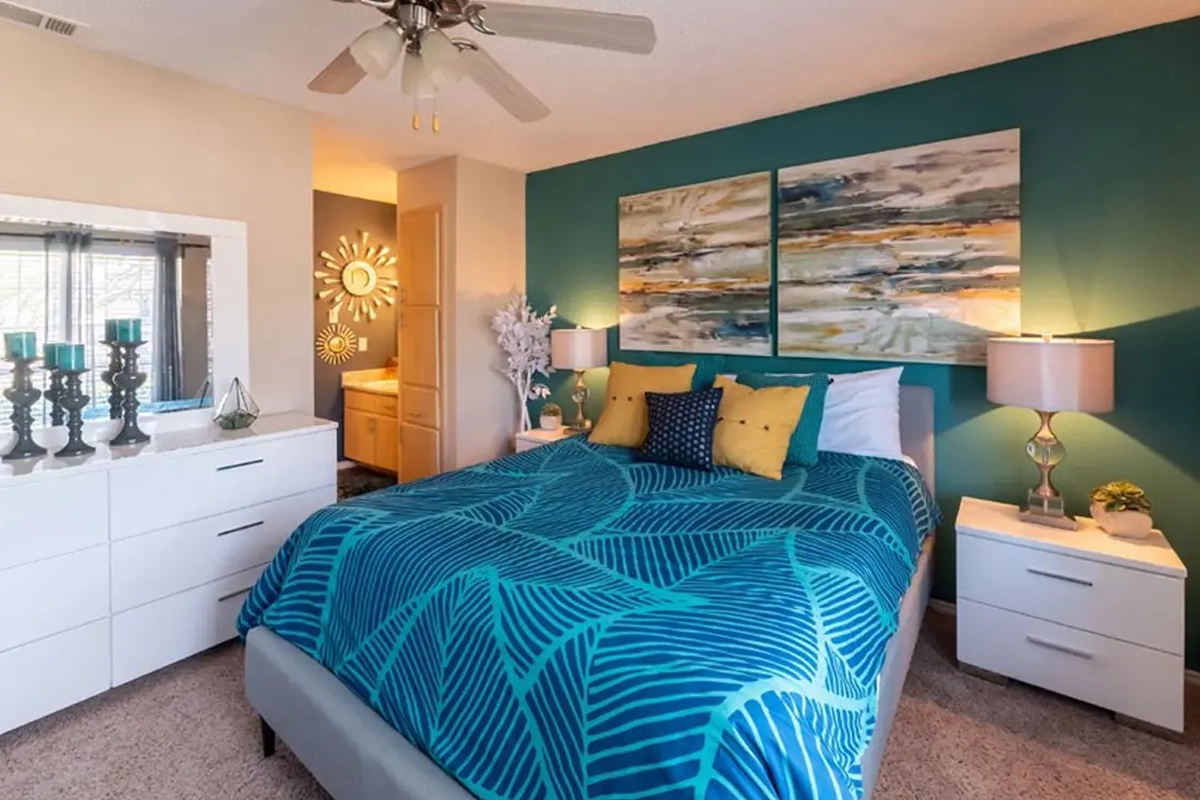 Primary bedroom suite inside an apartment at Village Green of Bear Creek in Euless, Texas